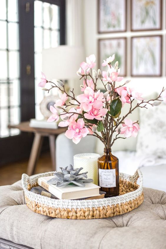 a vintage amber bottles with pink cherry blossom and foliage – such a silk flower arrangement will last long