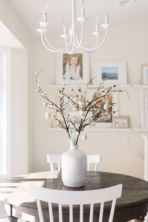 cherry blossom with pastel eggs hanging is a cool idea of an Easter decoration or a centerpiece