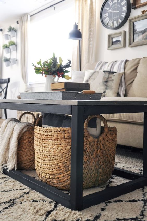 large rattan baskets placed under the table will save you some floor space and you can store blankets there