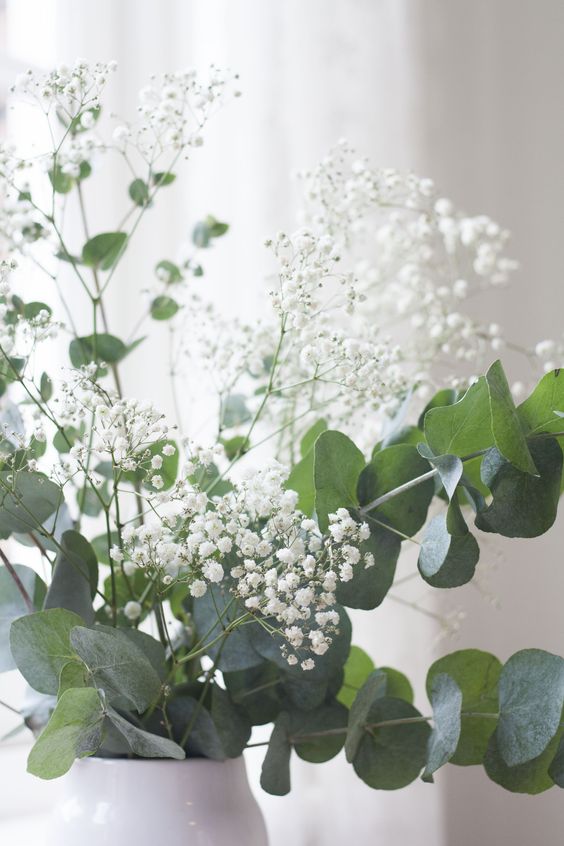 white baby's breath and eucalyptus is a fresh spring-like arrangement that will make any space amazing