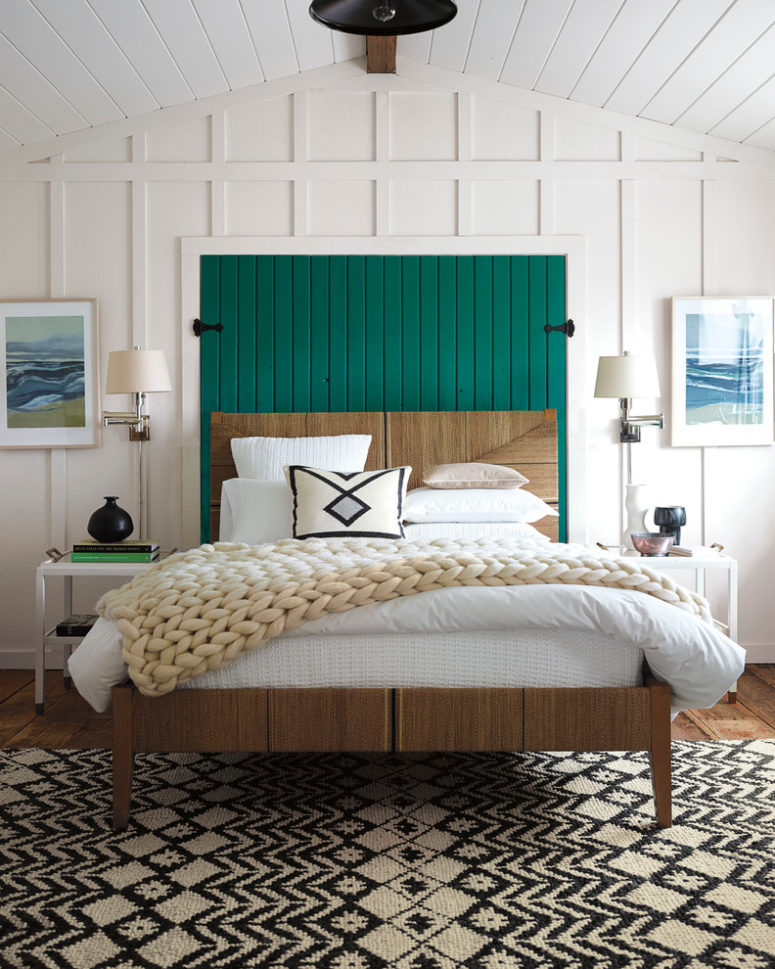 a mid-century modern meets farmhouse bedroom with white wooden panels, a bright emerald headboard, a printed rug  (Serena &amp; Lily)