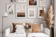 a beautiful nature-inspired gallery wall in light stained frames is a lovely decor idea to rock