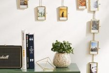 a chain with picture frames and photos in them is a creative and out-of-the-box display idea for your home