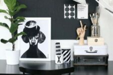 a monochromatic home office with a chalkboard wall used as a memo board – for making notes, for attaching stickers and other stuff