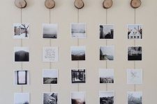 a nature-inspired gallery wall with Insta pics hanging on yarn from wood slice hooks is a cool idea