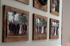 a rustic gallery wlal with photos attached to wooden planks is a stylish and cozy idea of decor