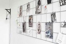 a simple metal grid on the wall will allow you to attach any photos you want to it and change them anytime
