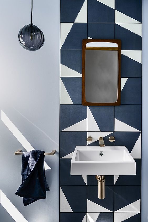 a catchy navy and white tile backsplash is a bold solution for any bathroom and it can be rocked in any modern space