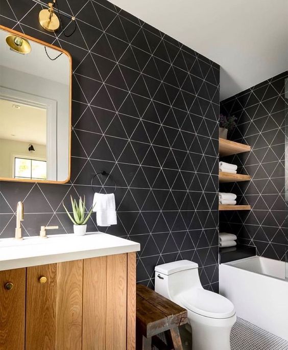 a stylish bathroom with catchy black geometric walls, white appliances and light stained wooden items is amazing