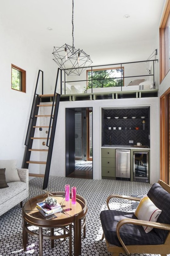 A cool small home with a kitchen and living room downstairs and a loft bedroom upstairs is a gorgeous mid century modern dwelling