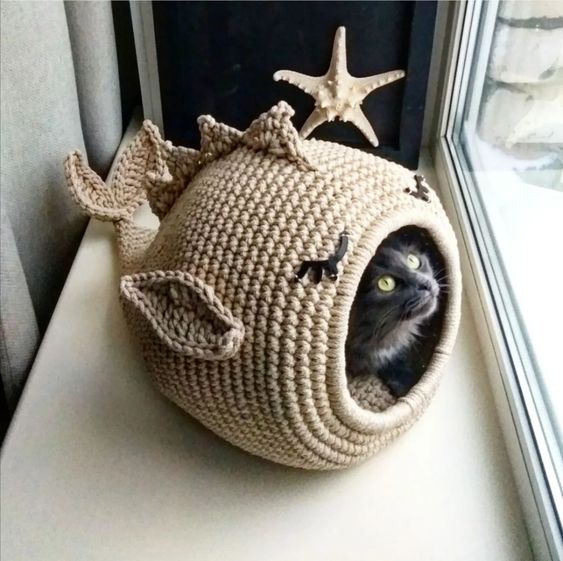 a knit fish cat bed and house is a funny and cool idea that will bring a touch of whimsy