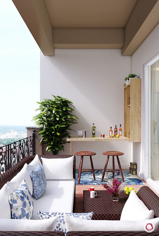 a large balcony with a Murphy desk as an outdoor bar, with stools and much storage space