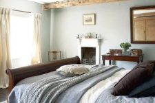 an interesting bedroom design with exposed wooden beams