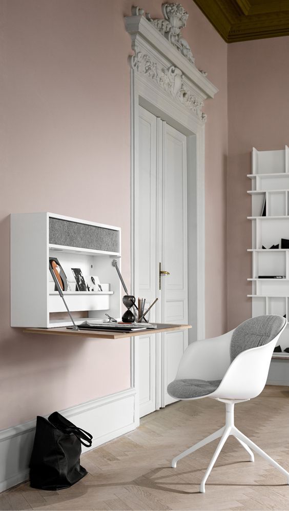 a minimalist storage unit with a foldable desk and a drawer inside will fit any minimalist space