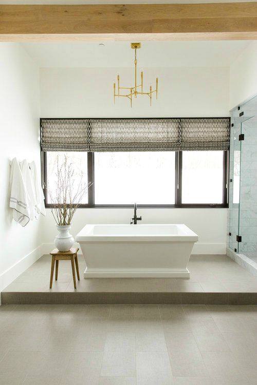 a platform makes the bathtub a focal point and creates a chic oasis for bathing and relaxing