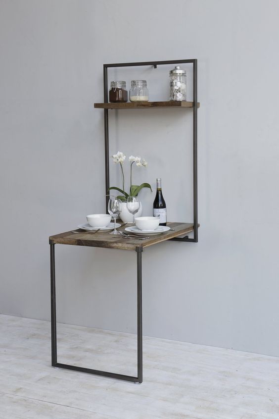 a rustic folding table like this one can be used for dining to as a breakfast nook and hidden anytime