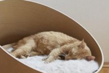 a sleek and stylish asymmetrical cat bed with faux fur is a chic idea for a contemporary or minimalist space