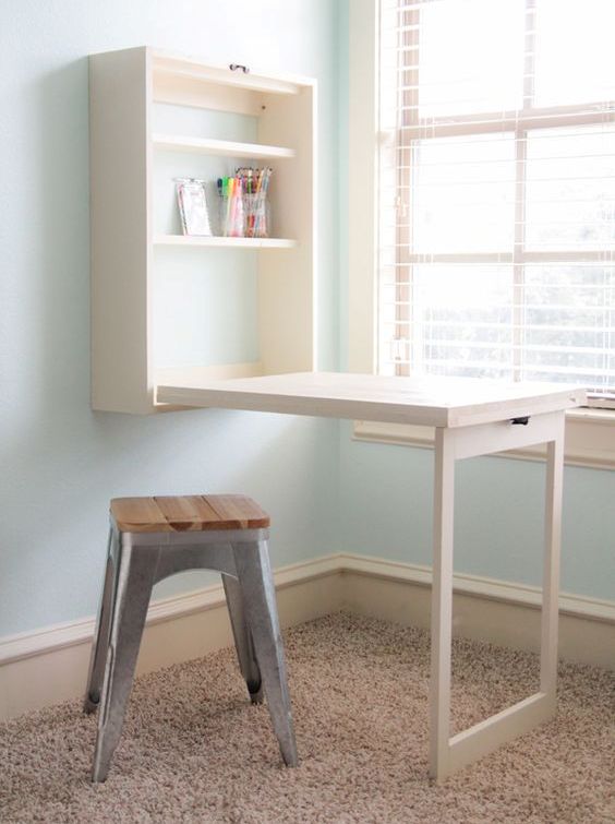 a white Murphy desk with storage shelves is great for crafters that don't have a separate room