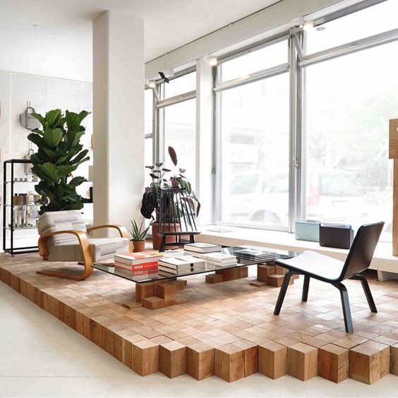 a wooden cube platform by the window is a gorgeous way to highlight the reading space