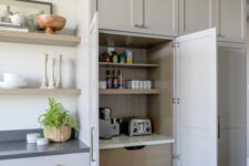 a breakfast station hidden inside a cabinet, with shelves, a toaster and a coffee machine plus drawers is a cool idea for anyone
