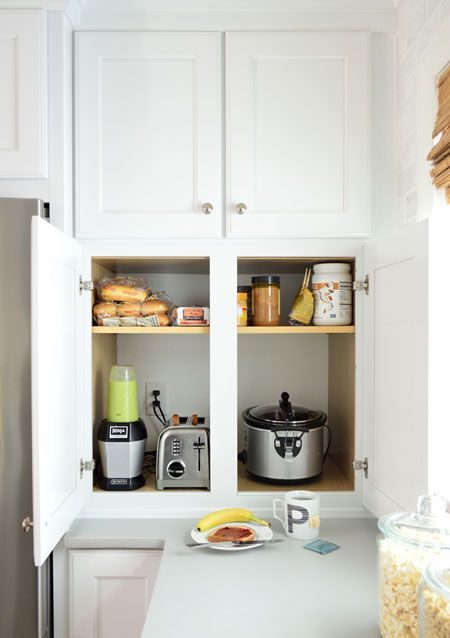 a cabinet with appliances and various stuff for making sandwiches is a cool idea for making breakfasts here