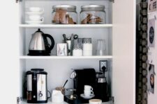 a cabinet with appliances, jars and mugs hidden inside and various stuff turn it into a pretty coffee station is a cool idea