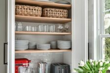 a cabinet with folding doors and open shelving inside, with appliances is a smart idea and folding doors don’t steal your space