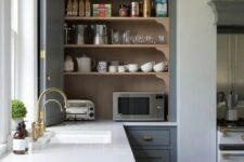 a kitchen cabinet with bi-fold doors hiding several appliances and various other stuff is a cool idea
