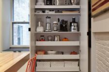a large storage unit with shelves and drawers, with various appliances and other stuff is a cool idea to hide everything