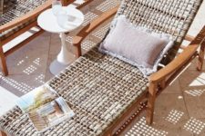 a stained wooden lounger with wicker and a cool pillow is a great idea for a touch of nature or a slight rustic feel