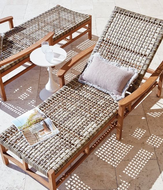a stained wooden lounger with wicker and a cool pillow is a great idea for a touch of nature or a slight rustic feel