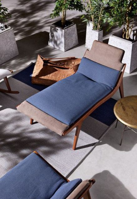 a stylish and sleek stained wooden lounger with taupe and blue upholstery is a nice idea for a modern or contemporary space