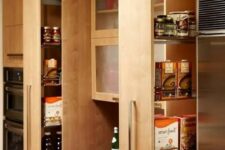 lots of vertical and usual drawers and glass cabinets will give you much storage space for all your kitchen stuff