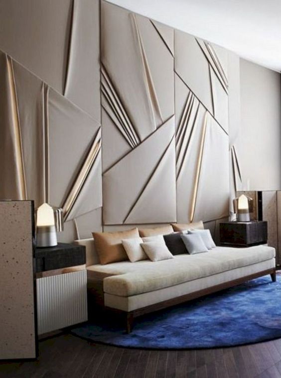 a draped fabric statement wall with lit up panels adds a chic geometric touch and a modern feel to the space