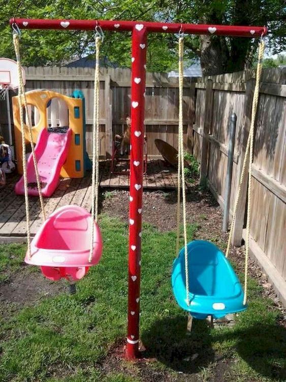 a simple colorful playground with swings, a colorful slide, a deck and a basketball space is awesome for active kids