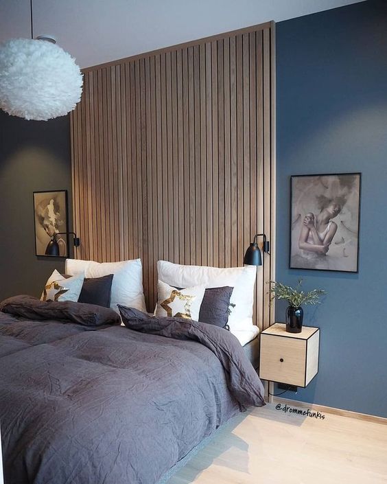 a sleek wooden slab accent wall that acts as a headboard is a stylish idea that complements a contemporary bedroom