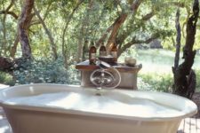 a vintage clawfoot bathtub with only the most necessary things is all you need to relax