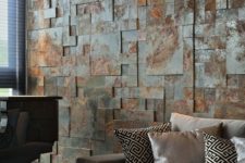an aged metal accent wall brings industrial esthetics to the living room