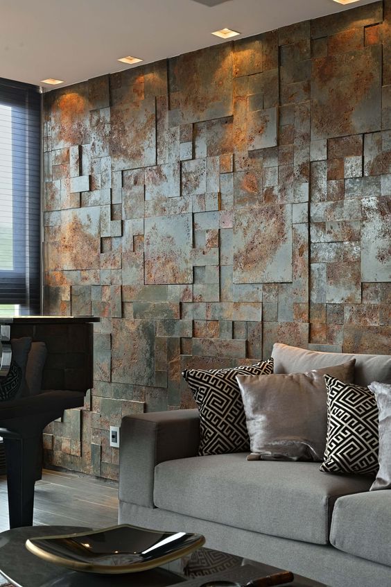 an aged metal accent wall brings industrial esthetics to the living room
