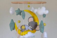 a colorful mobile with clouds, stars and a mouse sleeping on a half moon is a super cute and cool idea