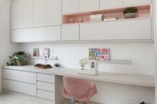a minimalist white home office with sleek cabinetry, open storage units, a built-in desk with much storage and a basket for stuff