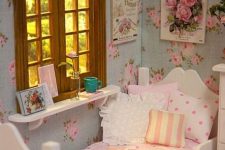 a shabby chic bedroom with floral walls, white furniture, pretty pink and striped bedding, a striped curtain and vintage posters