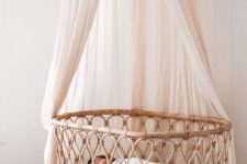 accent the bassinet with a neutral mosquito net and keep the bugs away from your little baby
