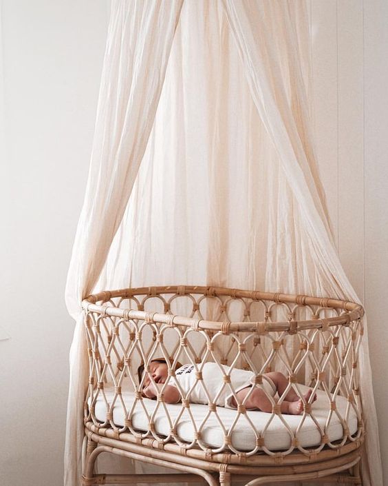 accent the bassinet with a neutral mosquito net and keep the bugs away from your little baby