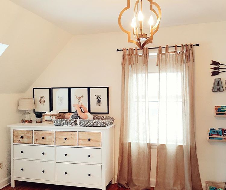 Hang some cute pictures above the dresser to create a cozy corner to change your baby. (via @birch_and_olive)