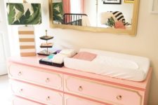 IKEA Malm dresser with coral paint, trim and ring pulls as a stylish mid-century modern changing table