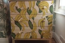 IKEA Tarva hack with painted bananas andgold knobs is a playful and whimsy item for storage