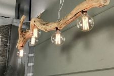 a beautiful and cool driftwood pendant lamp with large bulbs looks stylish, chic and very cool and inspires to reuse and recycle