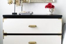 a black IKEA Malm dresser with white drawers, metallic corners and vintage metal handles for a touch of classic glam