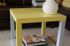 a bold and contrasting IKEA Lack table hack of two pieces in grey and bold yellow is a catchy touch of color to the space